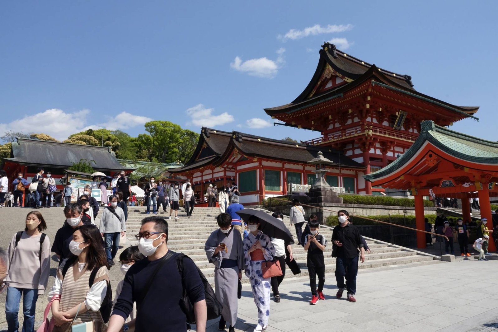 Japan ups daily arrivals cap, eases tourist restrictions